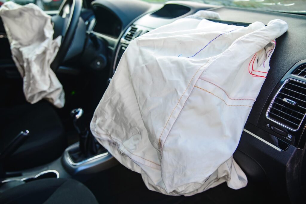 car airbag system deployed showing passenger side