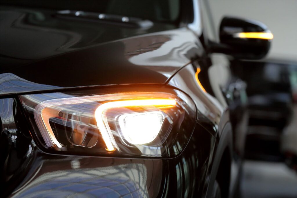 illuminated headlight of a black car