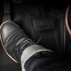 foot stepping on the clutch