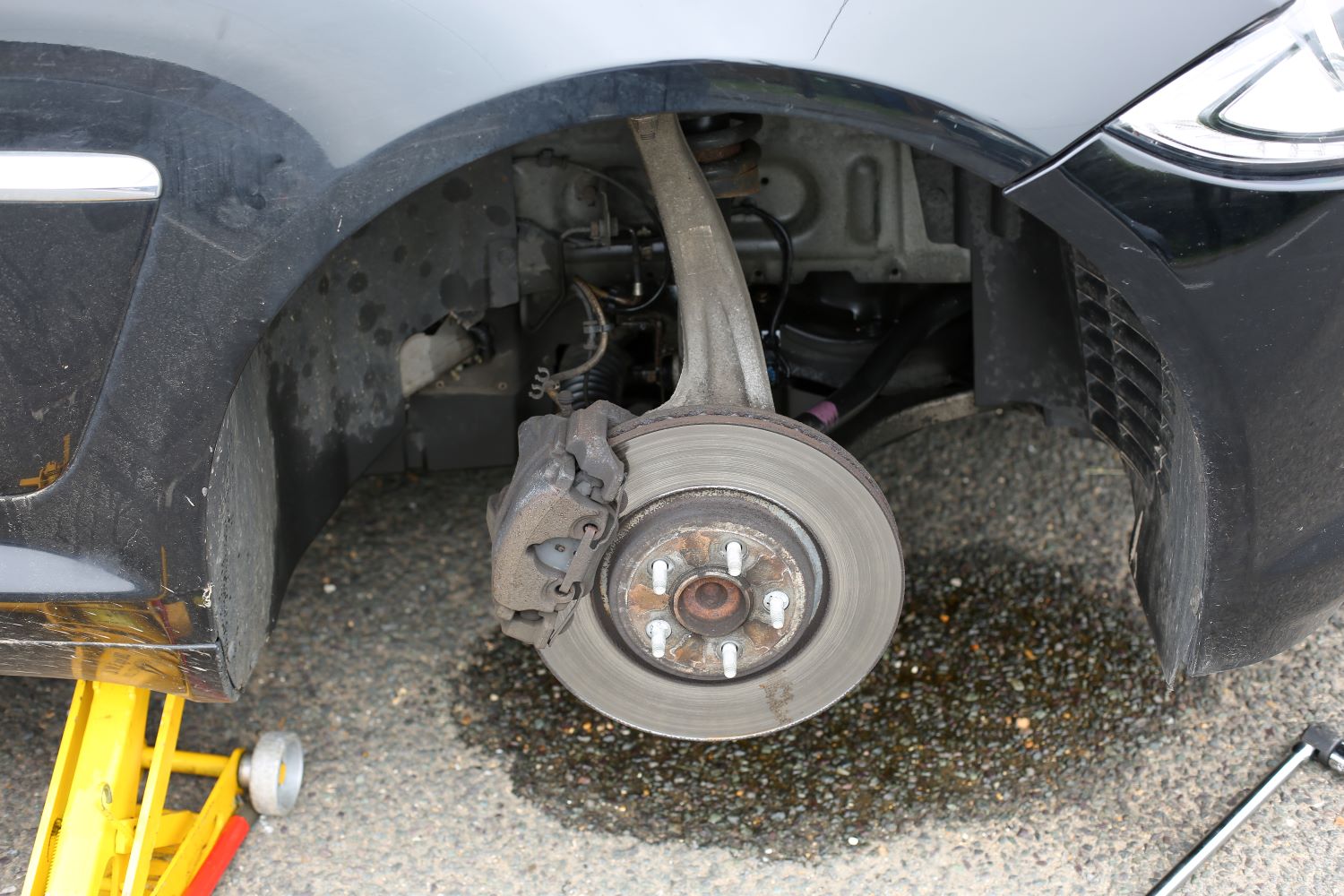Leaking Brake Fluid Causes and Dangers In The Garage with
