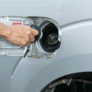 car fuel filler cap removed for fuel system cleaning