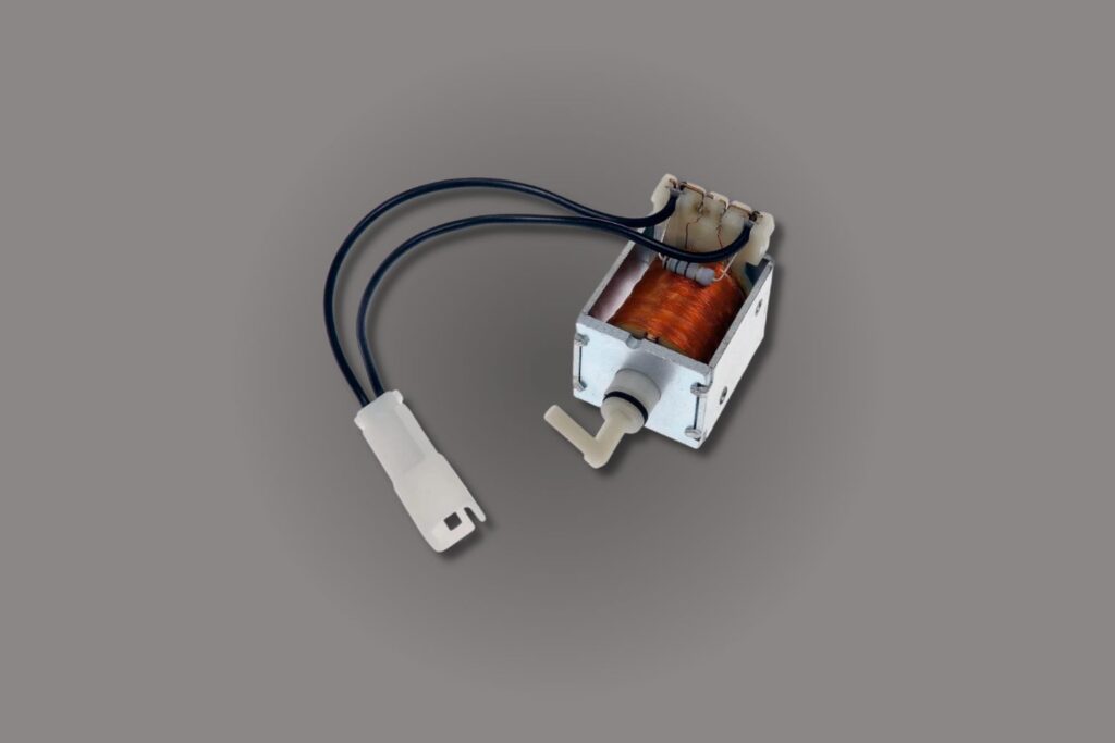 isolated image of a car shift interlock solenoid
