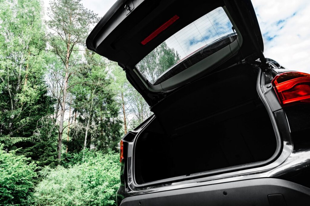 gray car with an open trunk