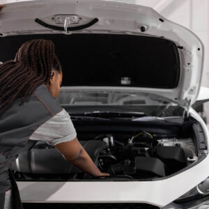 mechanic checking car with p1604 code