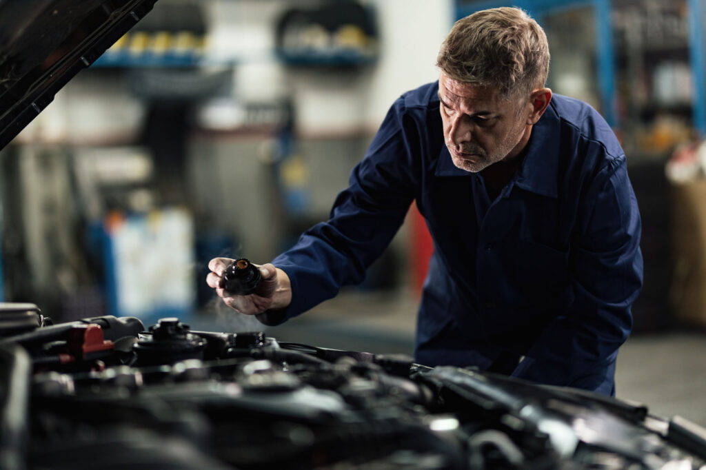 Auto,Mechanic,Opening,Radiator,Cap,While,Repairing,Car,In,A