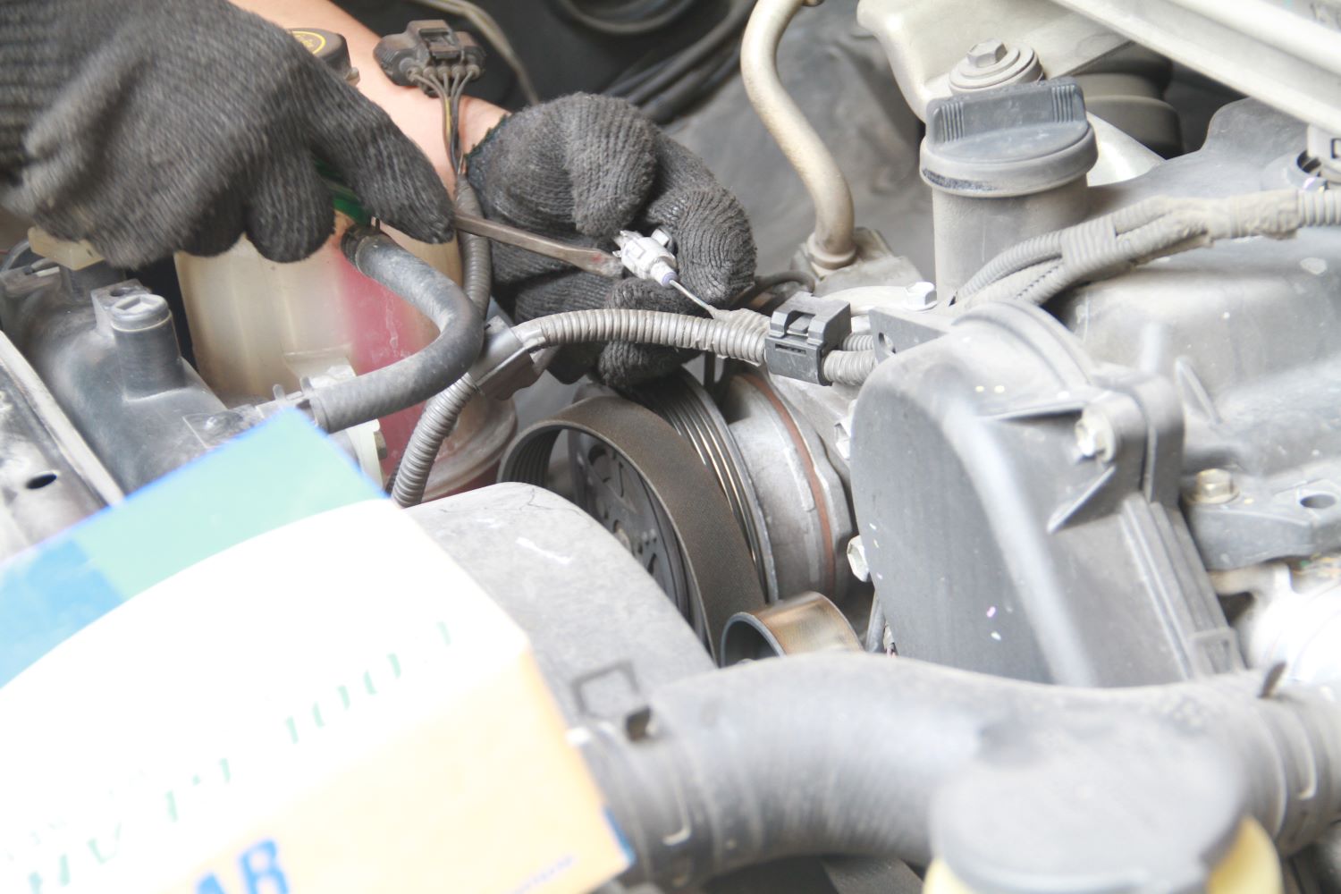 Why Is Your Car’s A/C Making A Rattling Noise? In The Garage with