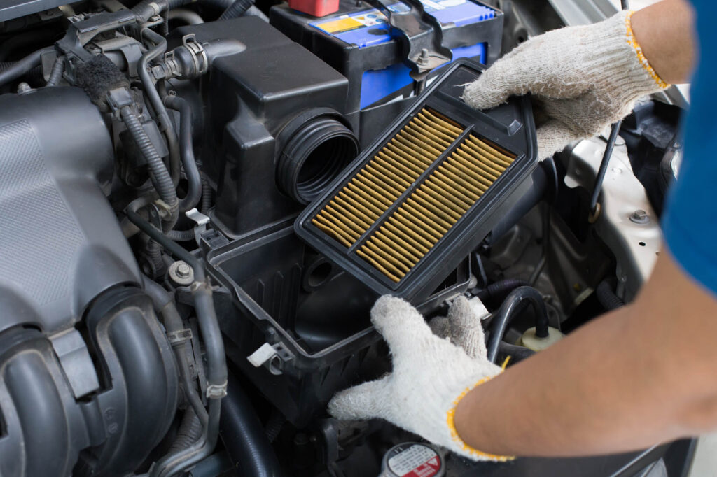 Change,Dirty,Air,Filter,Over,A,Car,Engine,During,General