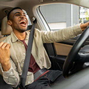 driver listening to music with speed sensitive volume active