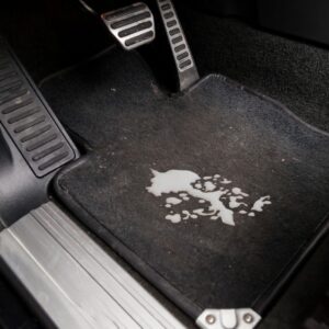 spilled milk on a car's carpet