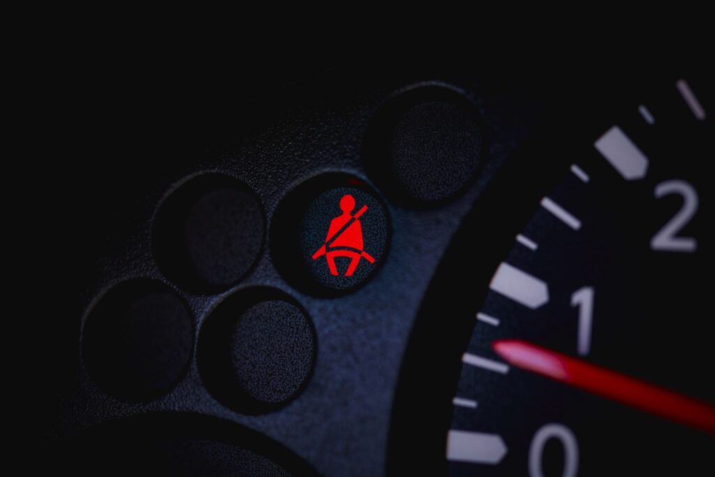 close up shot of a seatbelt warning light