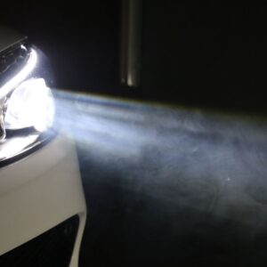 car headlight illuminating in the dark