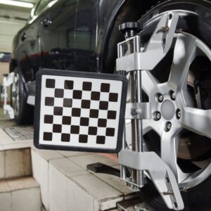 close up shot of a tire with tire rotation equipment