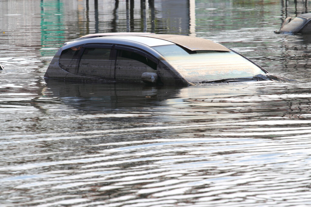 car in deep flood damaged