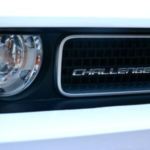 close up shot of a dodge challenger logo