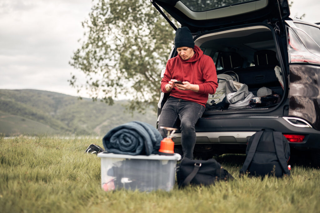 male preparing for car camping