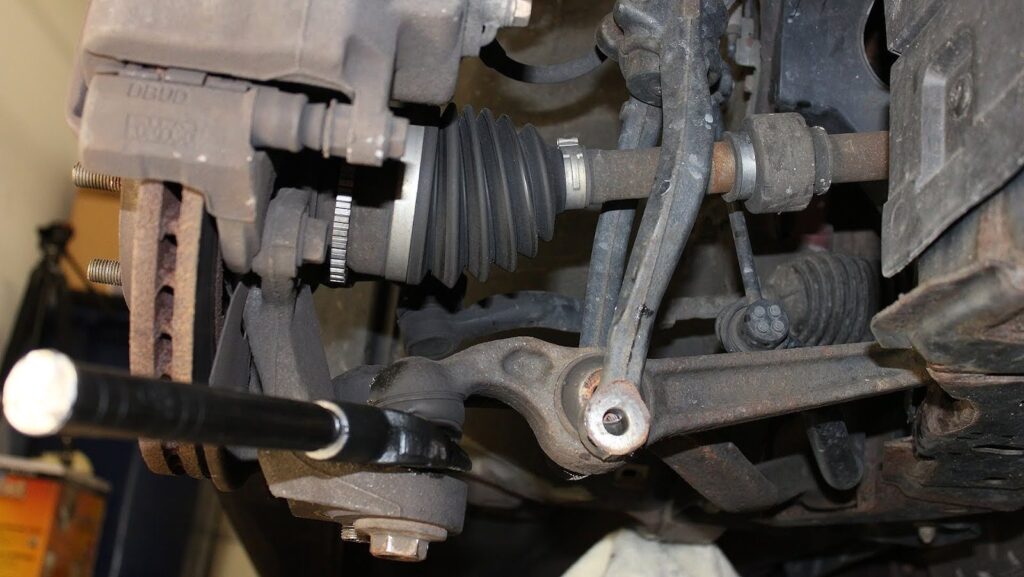 ball joints secured to the control arm with rivets