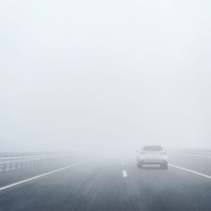 car on a foggy highway