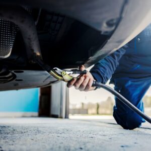 mechanic checking car emission