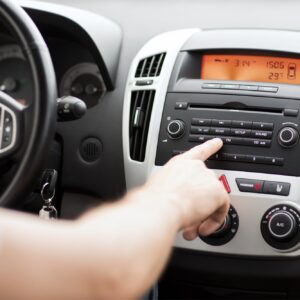 driver using car stereo