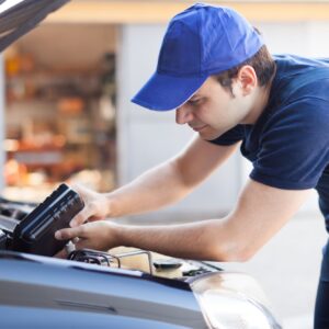 pouring synthetic oil to warm car
