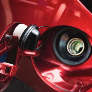 open gas tank of a red vehicle