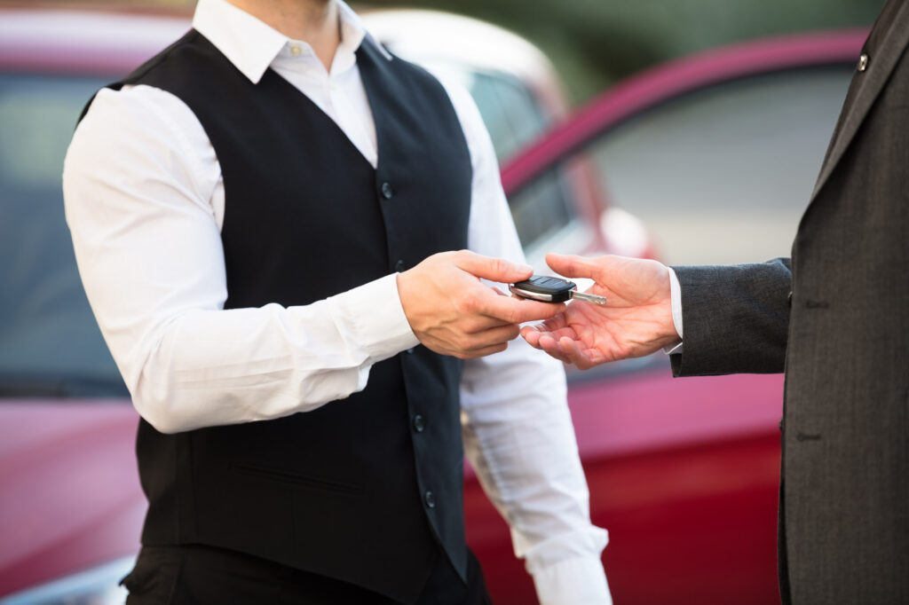 valet attendant returning car key