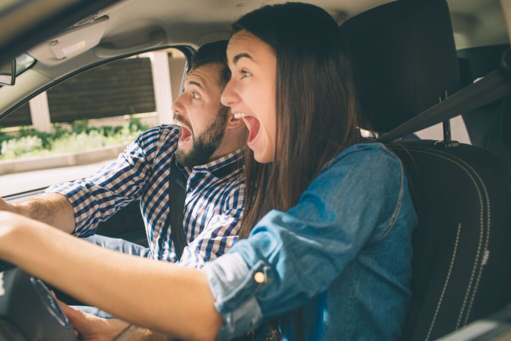 teenage driver with a scared passenger