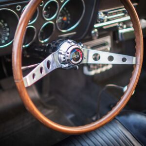 close up shot of a classic car 2 spoke steering wheel