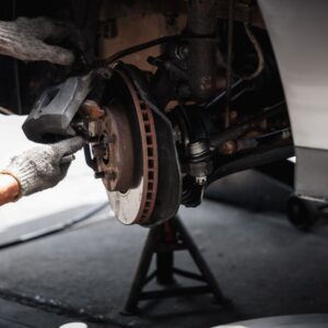 mechanic adjusting braking assembly