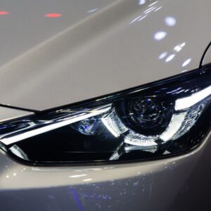 projector headlight of a white vehicle