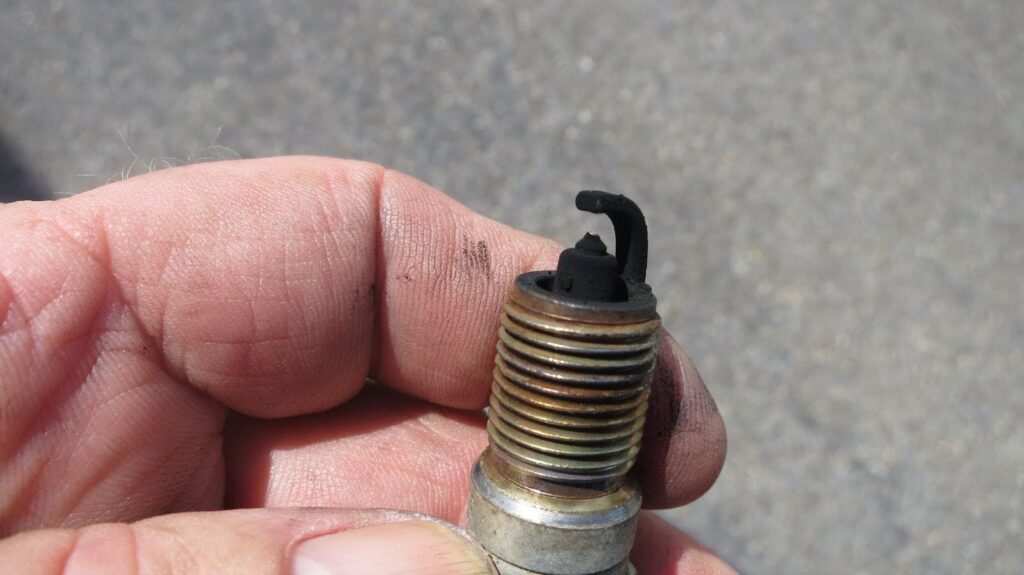a sooty spark plug from an engine that has been running too rich