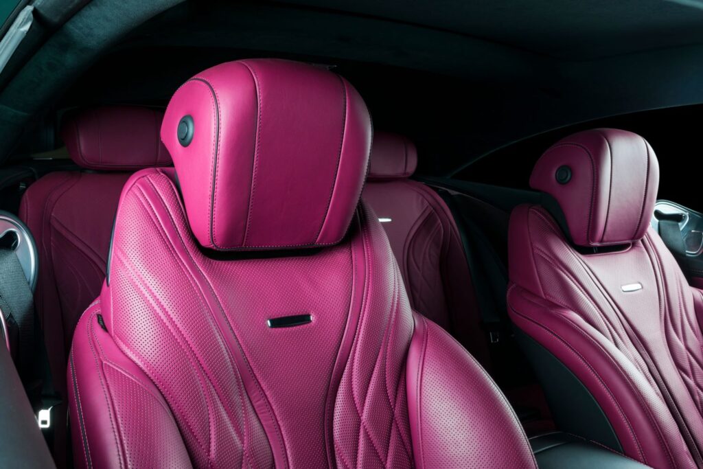 close up shot of pink leather car seats