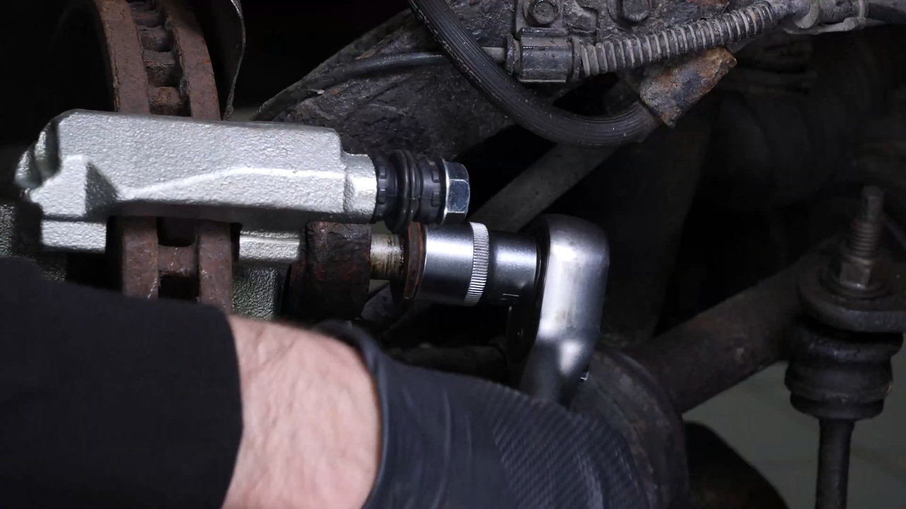 Remove the  brake caliper mount