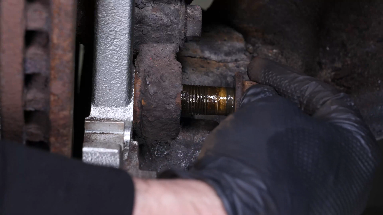 Remove the  brake caliper mount