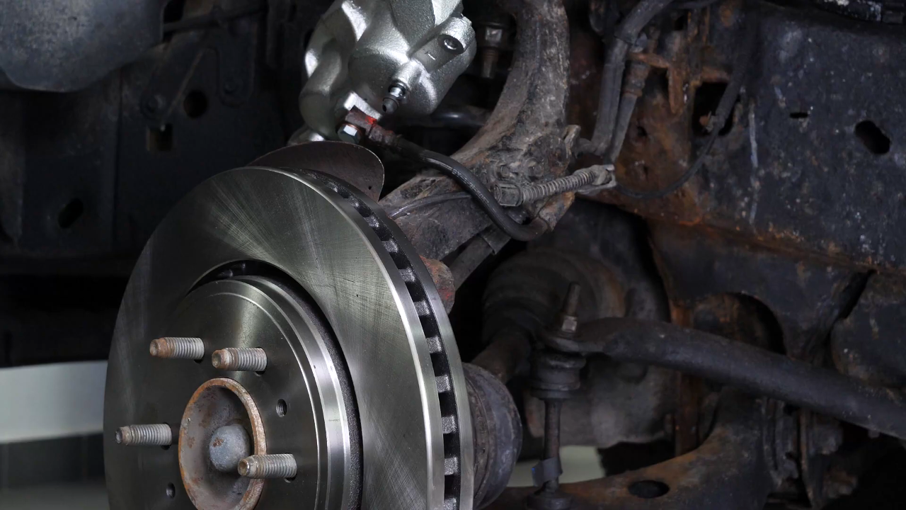 Put the brake caliper mount back on