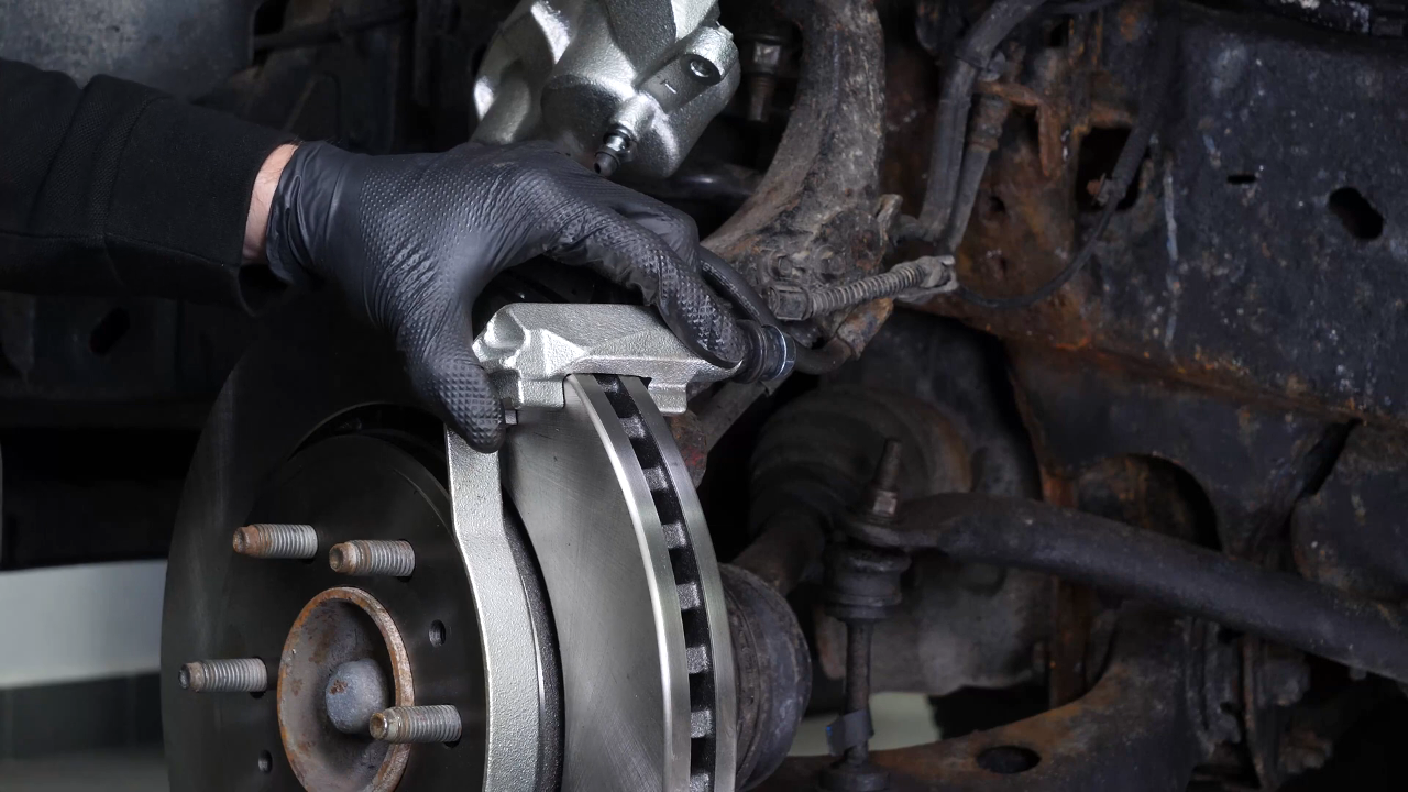 Put the brake caliper mount back on
