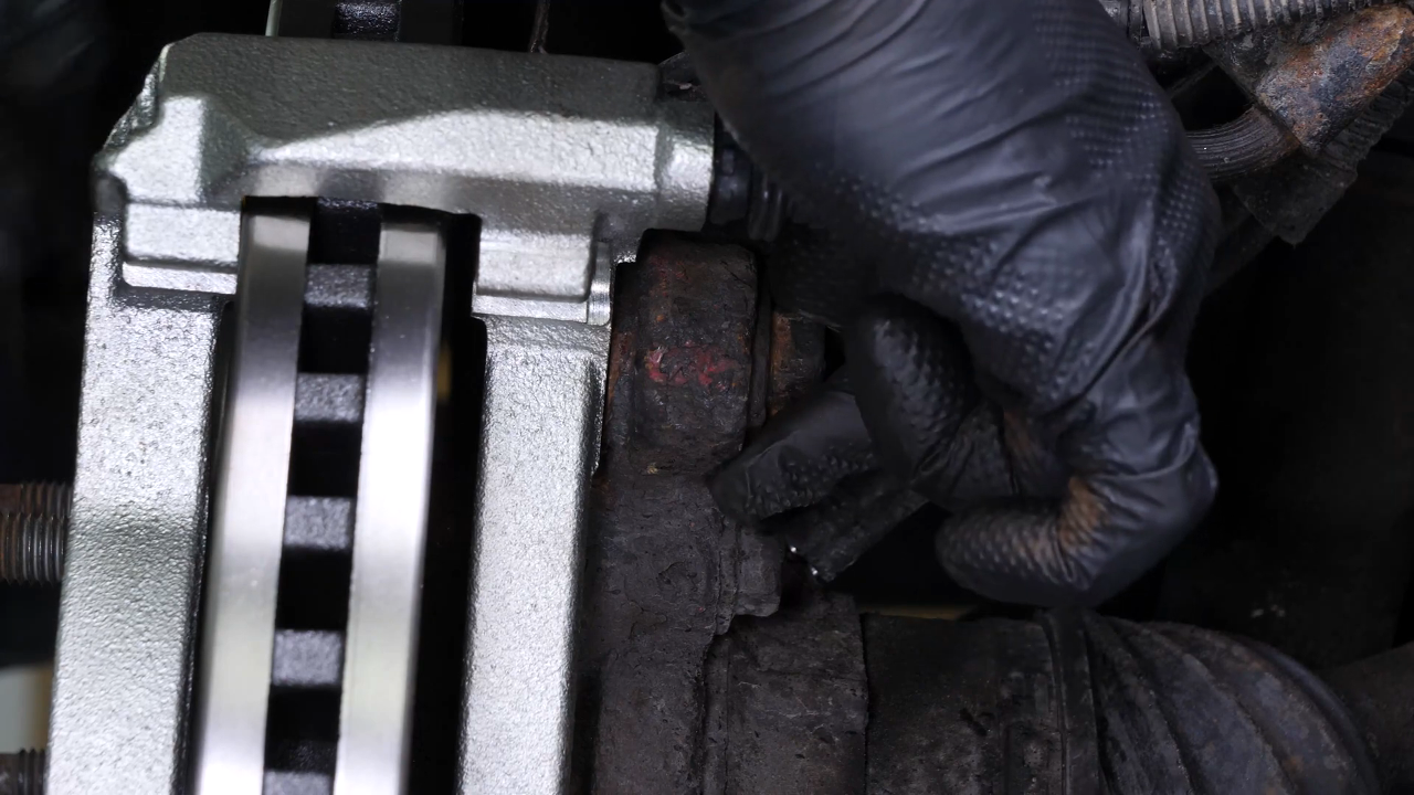 Put the brake caliper mount back on