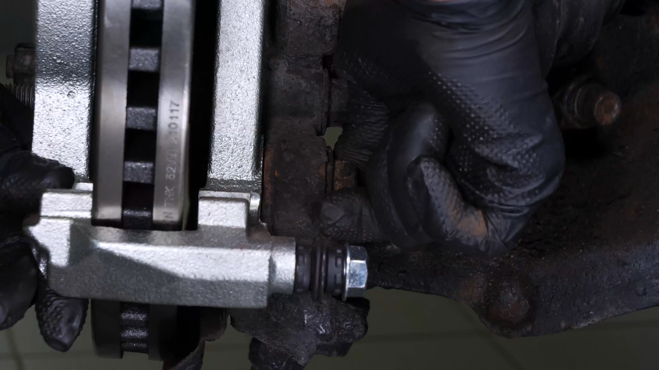 Put the brake caliper mount back on