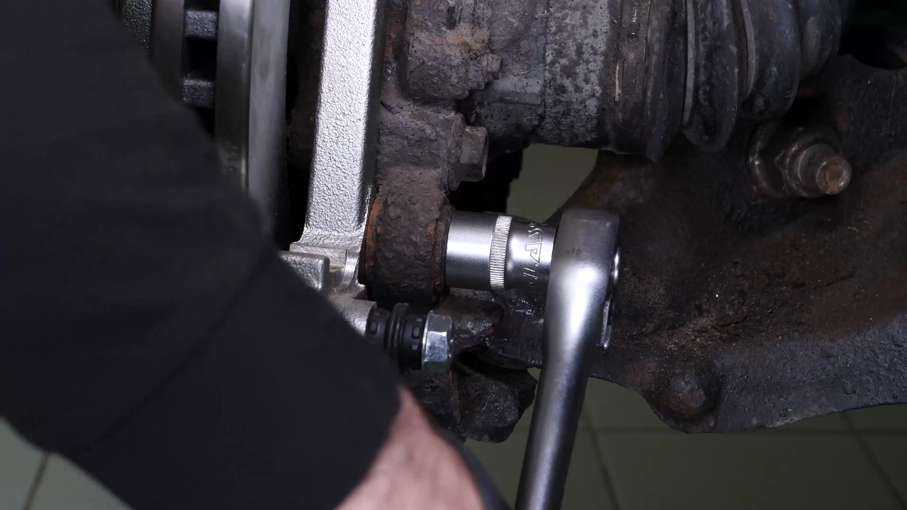Put the brake caliper mount back on