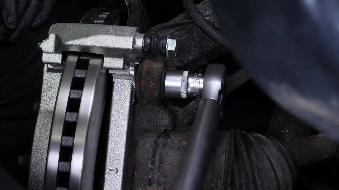 Put the brake caliper mount back on