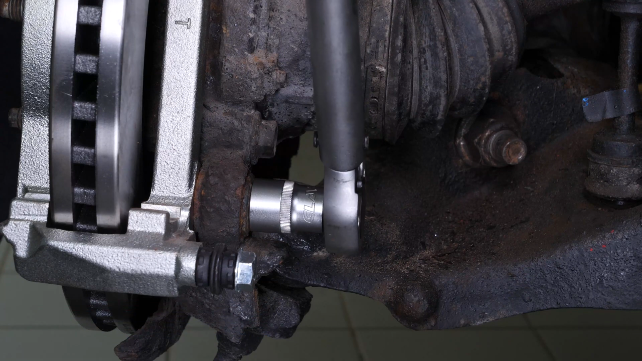 Put the brake caliper mount back on