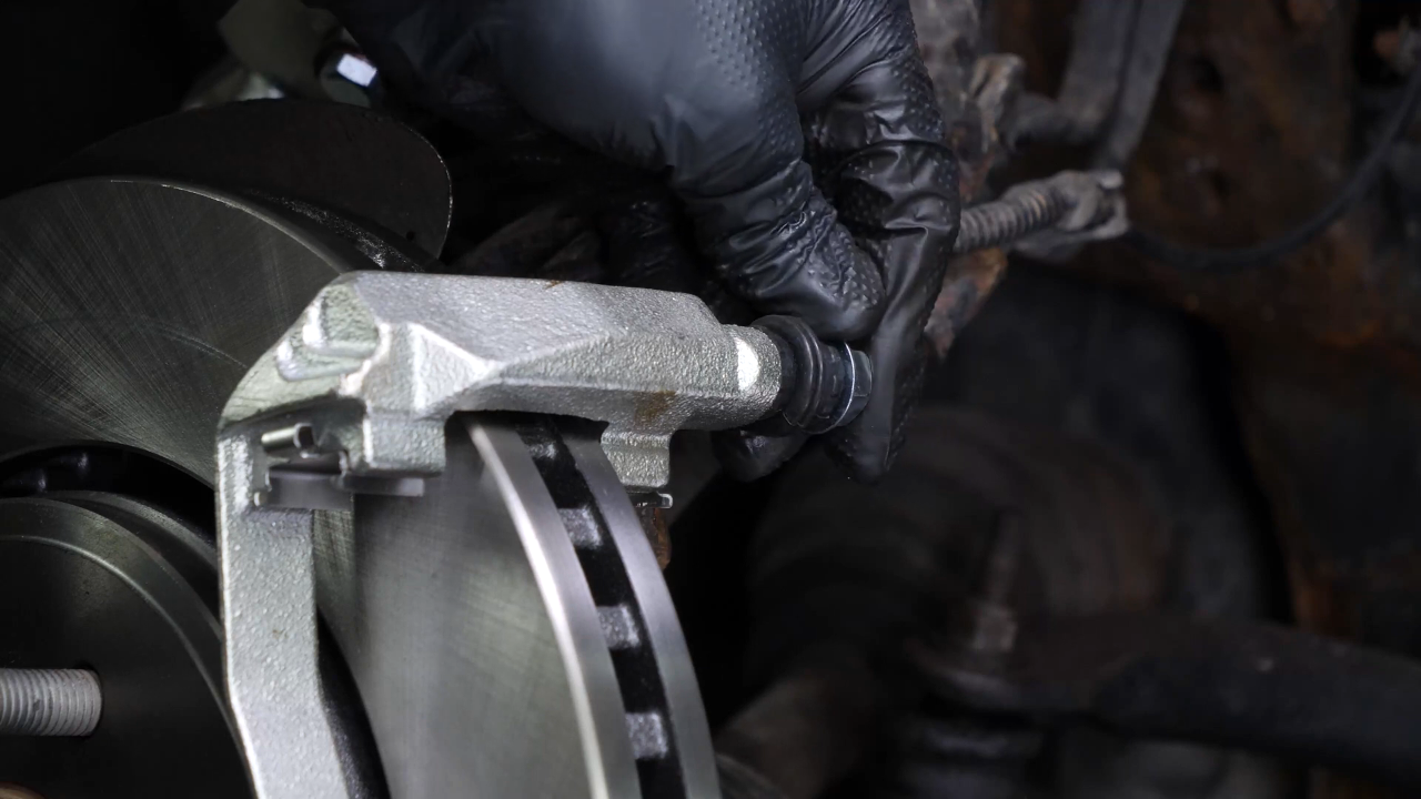 Put the brake caliper mount back on