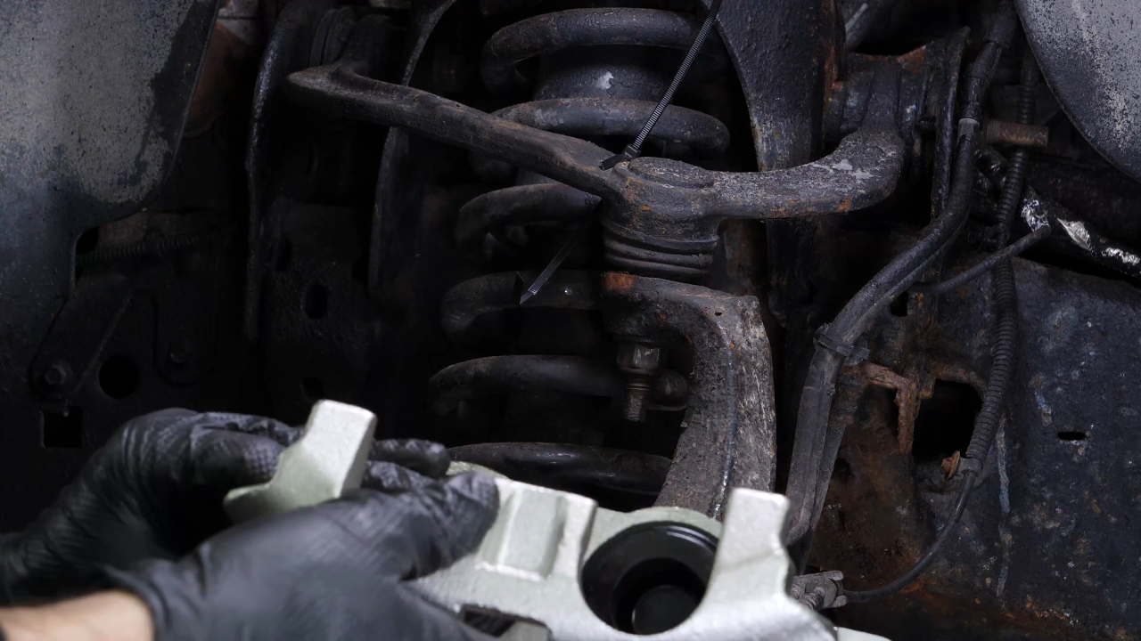 Put the brake caliper back