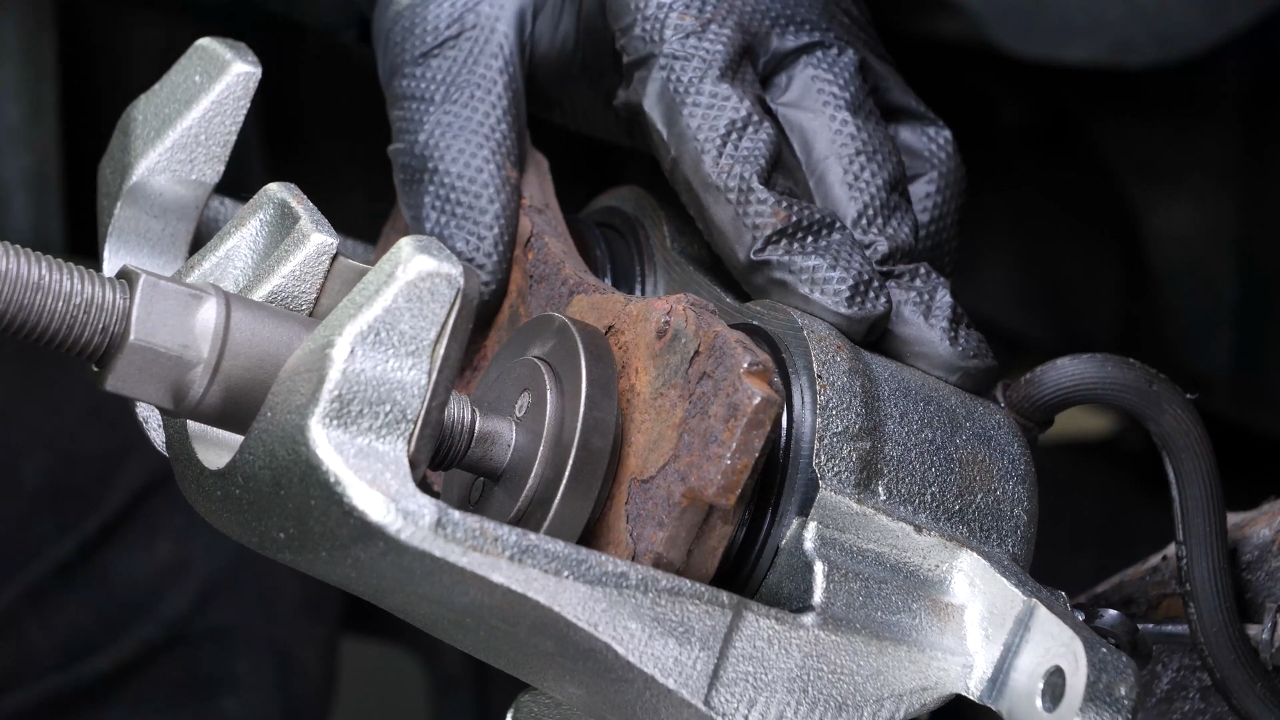 Put the brake caliper back