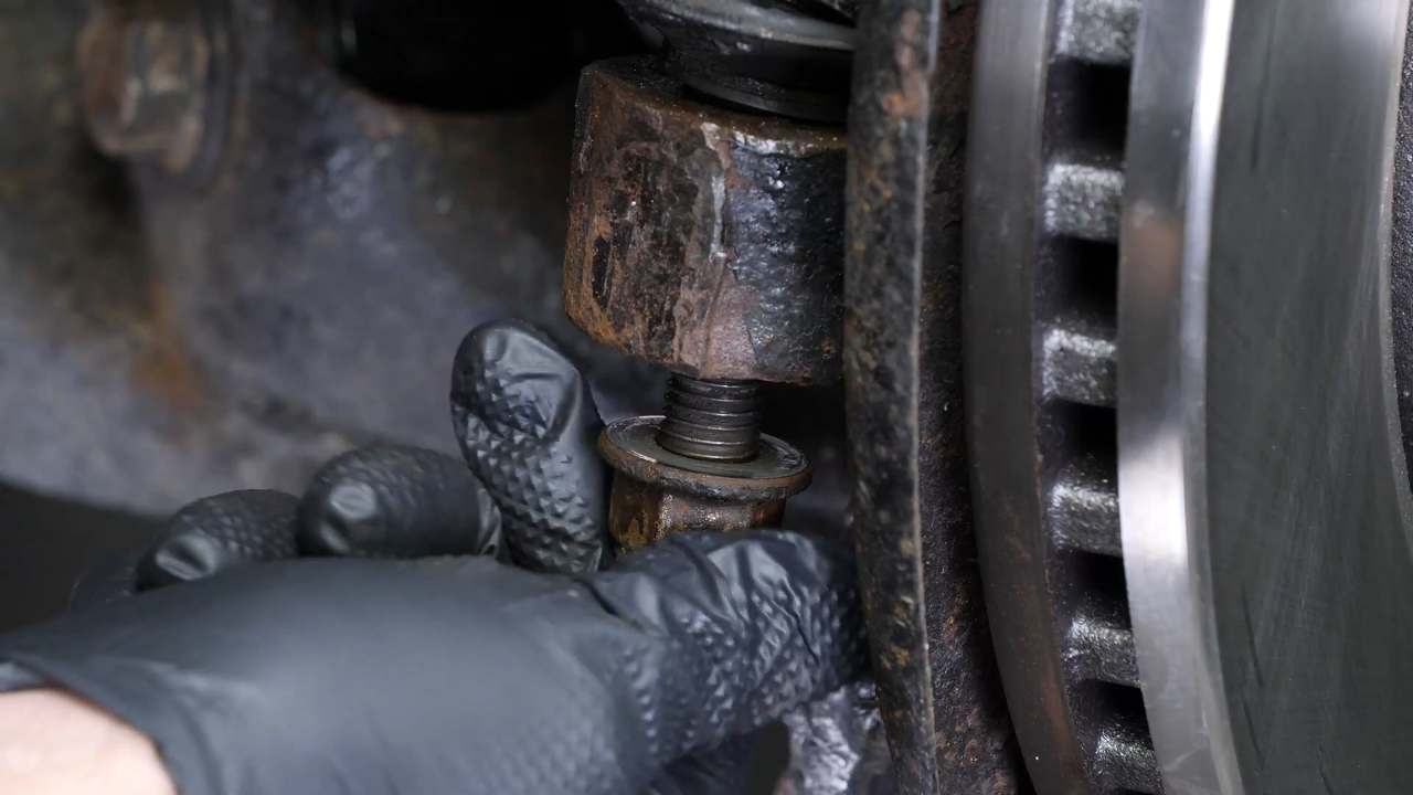 Loosen the holding nut
