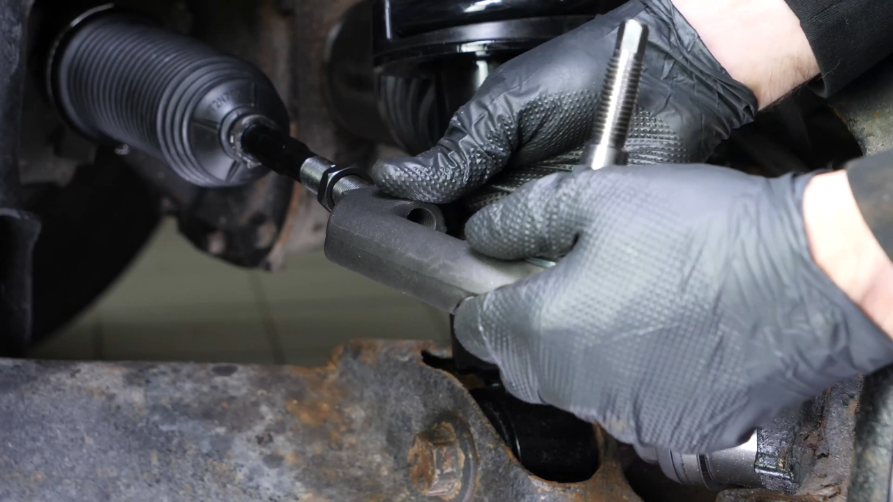 Put the outer tie rod back