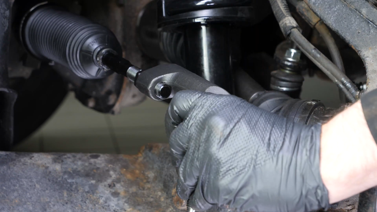Put the outer tie rod back