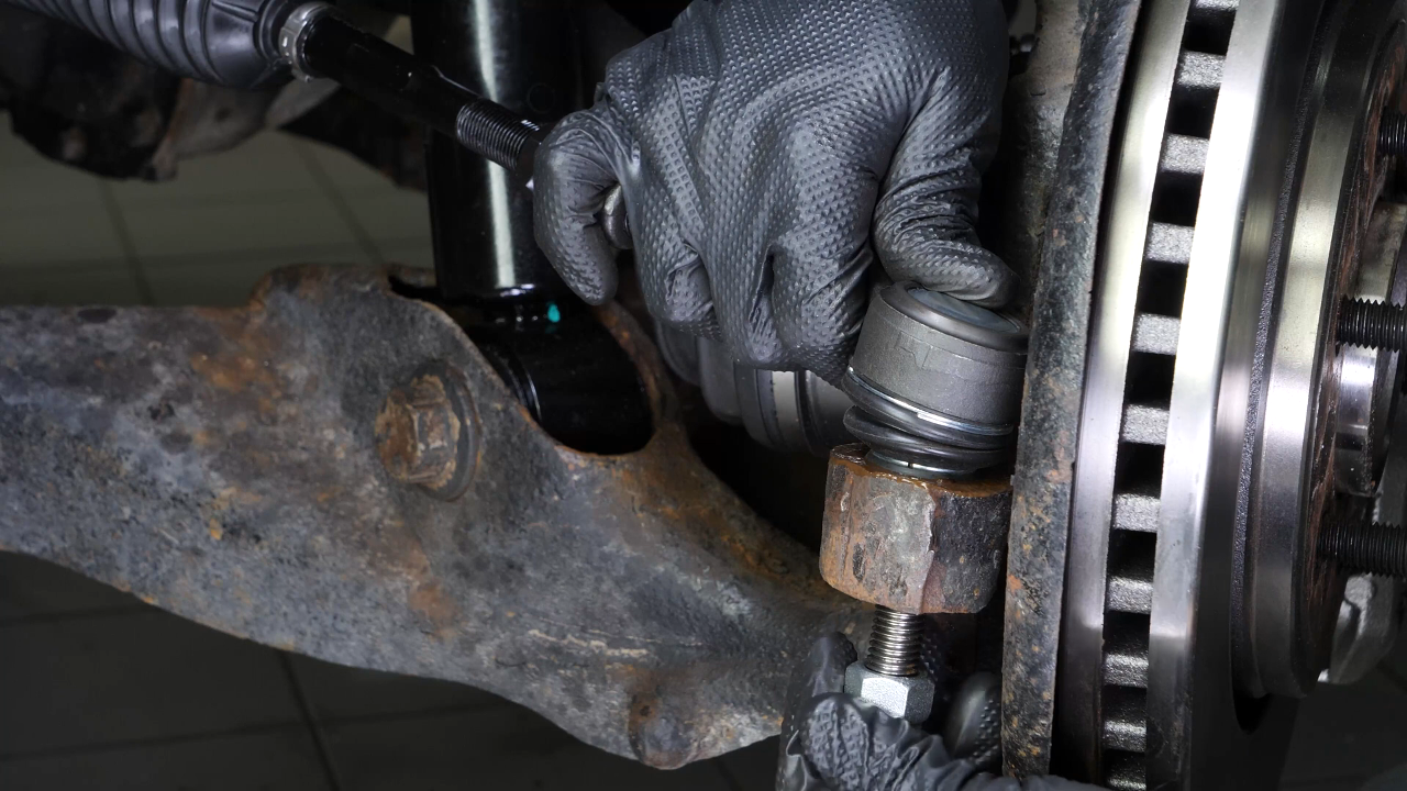 Put the outer tie rod back