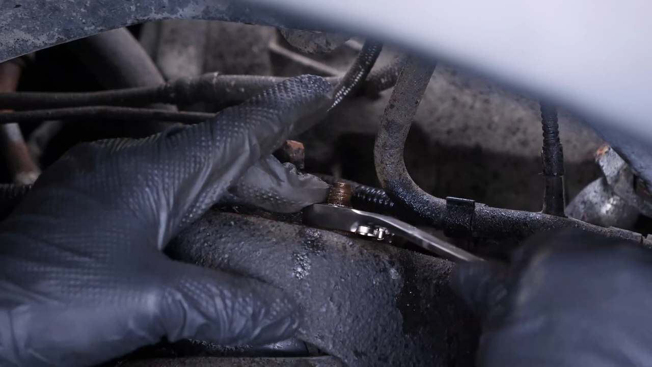 Unscrew the strut mount bearing nuts