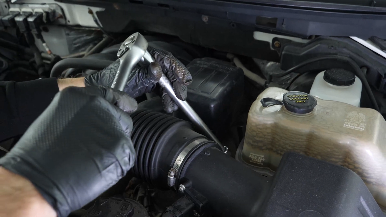 Unscrew the strut mount bearing nuts